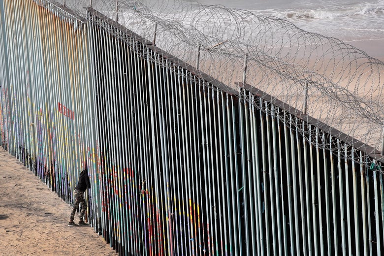 A woman looks through the border wall that separates the U.S. and Mexico on January 28, 2019 in Tijuana, Mexico.